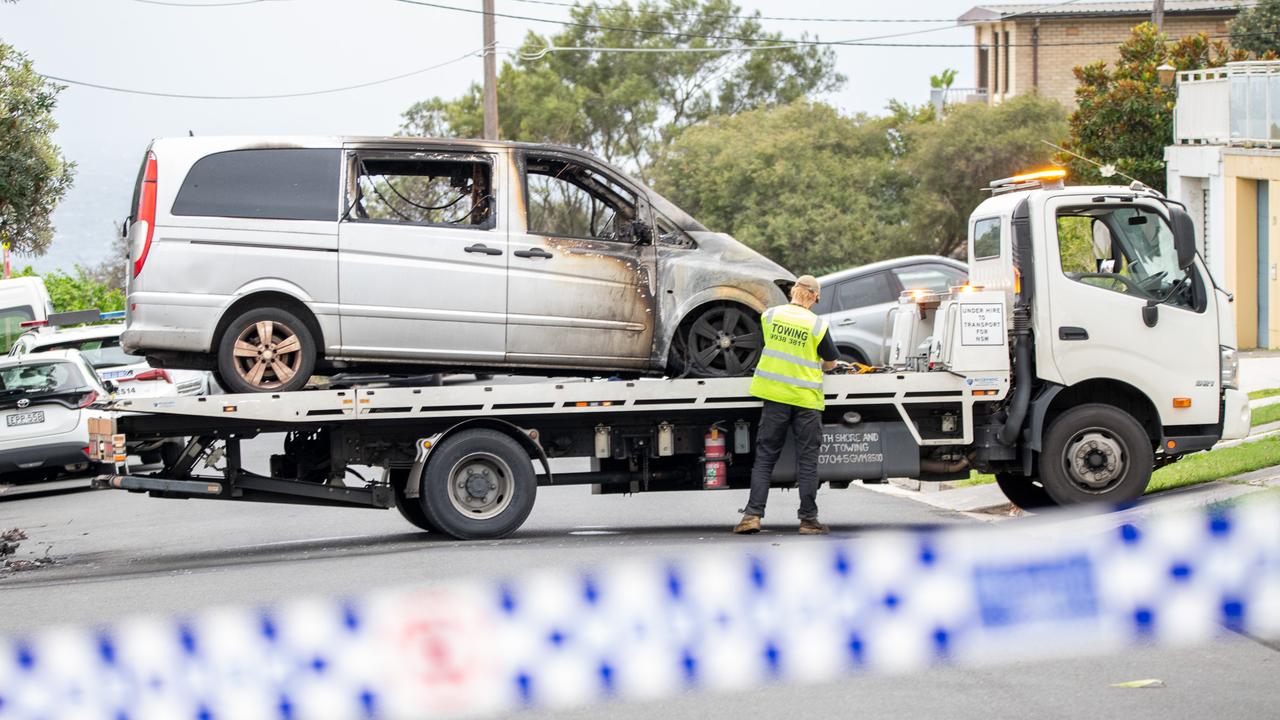 One of the damaged vans being towed away. Picture: Thomas Lisson