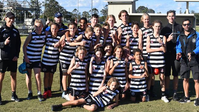 Siena Catholic College's junior boys team celebrates winning the Sunshine Coast round of the AFLQ Secondary Schools Cup.