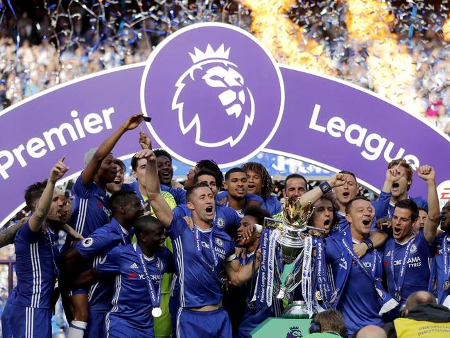 FILE - In this Sunday, May 21, 2017 file photo, Chelsea captain John Terry, right, and Gary Cahill raise the trophy after they won the English Premier League, after their soccer match against Sunderland at Stamford Bridge stadium in London. Chelsea collected 150.8 million pounds ($195 million) in broadcast revenue and prize money for winning the Premier League, earning almost two-thirds more than Leicester the previous year after profiting from new television deals. (AP Photo/Frank Augstein, file)