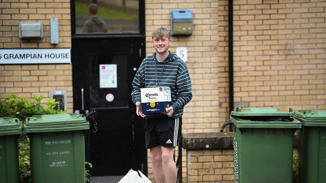 Students from Glasgow University receive food parcels at their accommodation at Murano Street student village after they were placed under Covid restrictions. Picture: Hundreds of university students across Scotland have recently tested positive for the virus. Picture: Jeff J Mitchell/Getty Images