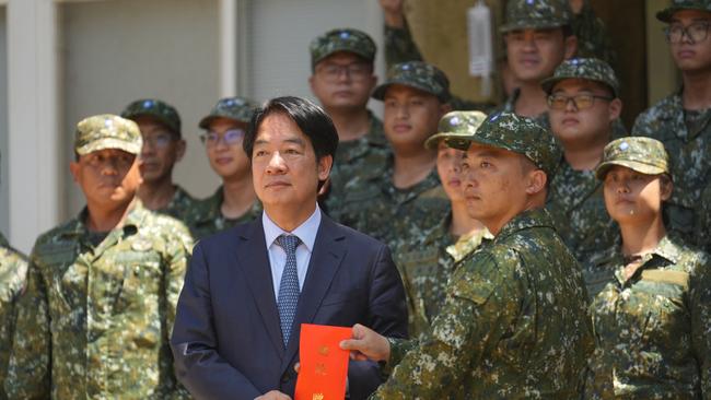 Taiwan President Lai Ching-te poses for a picture with navy personnel during a visit to inspect military troops at the Air Defence Company, North Camp Area of Dacheng in Penghu Island on September 6. Picture: Walid Berrazeg/AFP