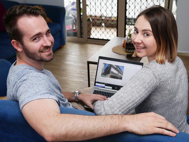 Georgina Auton and Jordan McNee pose in Indooroopilly, Brisbane on Wednesday, August 14, 2019. The couple are looking for their first home. (AAP Image/Claudia Baxter)