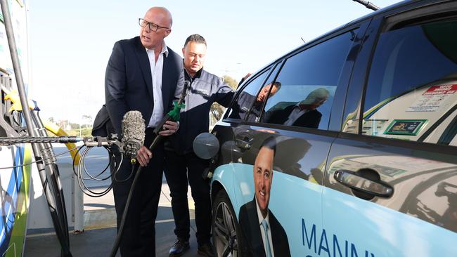 Peter Dutton made his 15tth petrol stop of the election campaign in the Melbourne suburb of Scoresby. Picture: Adam Head / NewsWire
