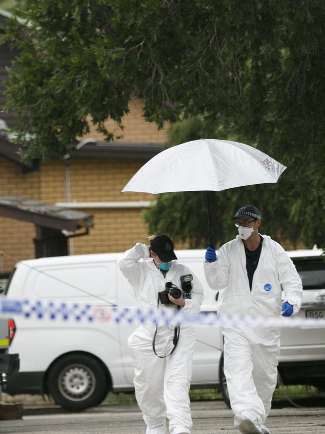 Forensics police were taking photos at the back of the shops. Picture: Tim Pascoe