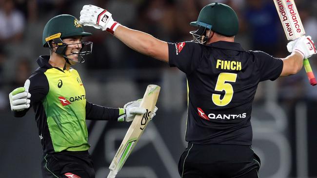 Alex Carey and Aaron Finch celebrate a T20I win over New Zealand.