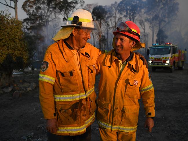 NSW Rural Fire Service volunteer father and son team Bob and Greg Kneipp after successfully defending a property in Torrington, near Glen Innes, on Sunday. Picture: AAP/Dan Peled