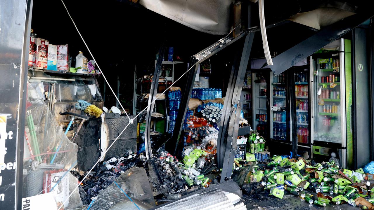 Manhunt after ute rams into shop