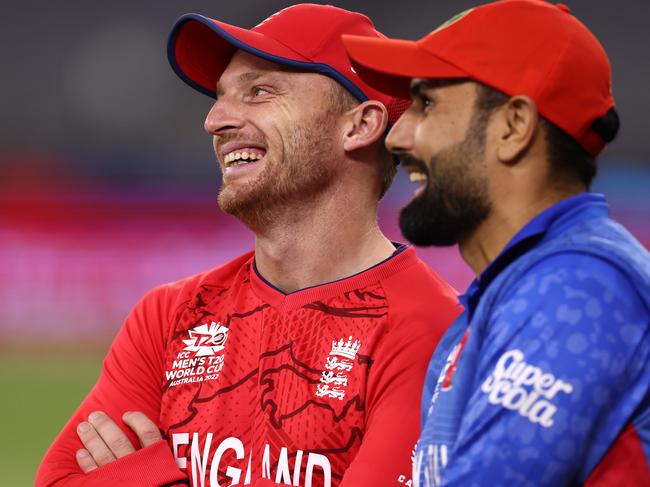 Jos Buttler of England (L) shares a moment with Mohammad Nabi of Afghanistan followingd the ICC Men's T20 World Cup match between England and Afghanistan at Perth Stadium on October 22, 2022 in Perth, Australia. (Photo by Paul Kane/Getty Images)