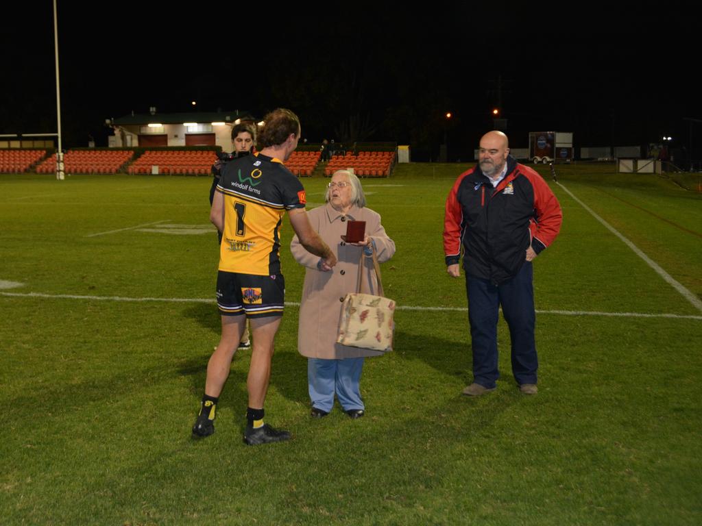 Thelma Pollard presenting Luke Self with the Bill and Stephen Pollard Family medal for 2023.