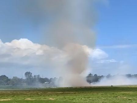 A vehicle that caught fire sparked a fire on the Sunshine Motorway at Pacific Paradise. Picture: Ellen King