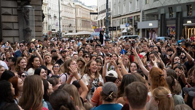 Taylor Swift fans sing together in the centre of Vienna on Thursday. Picture: Getty Images