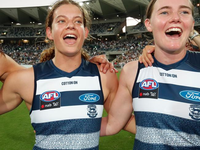 Nina Morrison celebrates the Cats’ win with teammate Denby Taylor on Saturday. Picture:  AFL Media/Getty Images