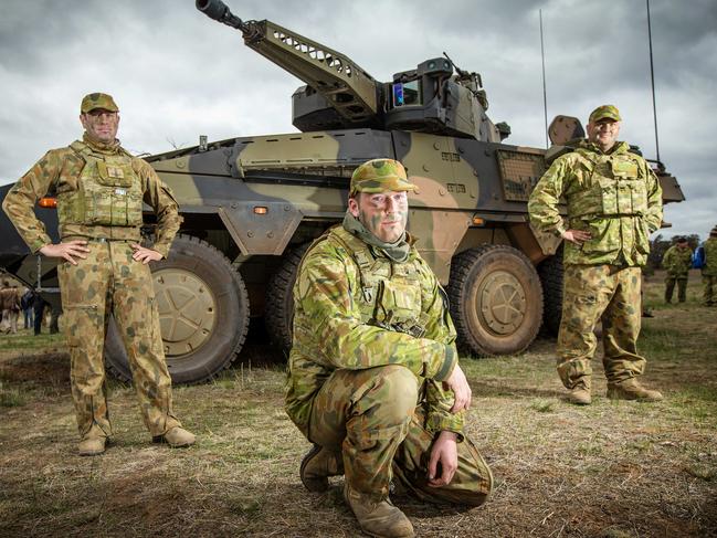 The Australian Army holds its 2018 firepower demonstration Exercise Chong Ju at the Puckapunyal Training Area. L to R Sgt James Mathews, Trooper James Sauter and Corporal Christopher Brennan with the Land 400 CRV Boxer. Picture: Mark Stewart