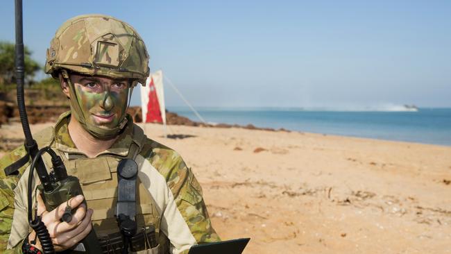 An Australian soldier conducts communications during the amphibious assault at Fog Bay, in the Northern Territory, during Exercise Talisman Sabre. Picture: Corporal Mark Doran/ADF