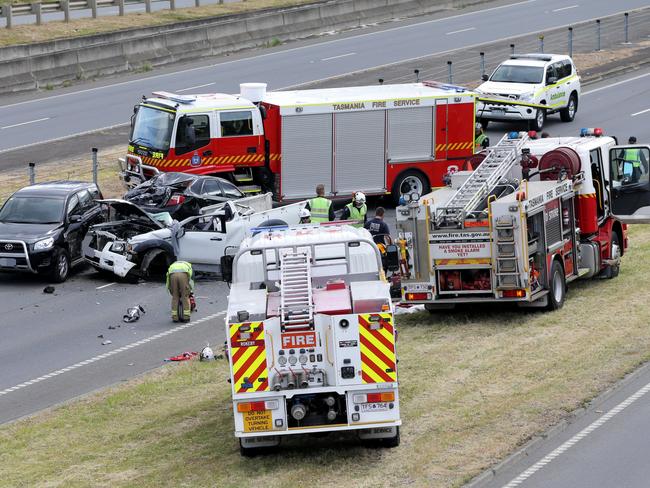 Emergency crews at the scene of the afternoon crash on the Tasman Highway on Hobart’s Eastern Shore. Picture: LUKE BOWDEN