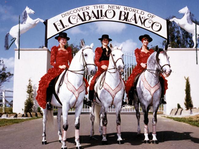 Riders on horses at the entrance of El Caballo Blanco, home of the famous dancing stallions, 1984.