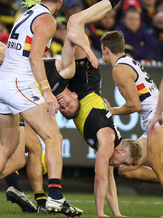 Richmond’s Josh Caddy lands after trying to take a mark. Picture: Michael Klein