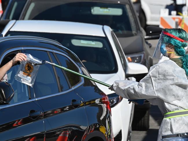 A healthcare worker collects a self-administered coronavirus test in Los Angeles, California. Picture: AFP