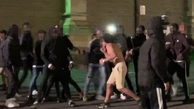 Stills from a video taken in the early hours of Sunday morning of youths fighting outside St Paul’s Cathedral during the Moomba Festival.