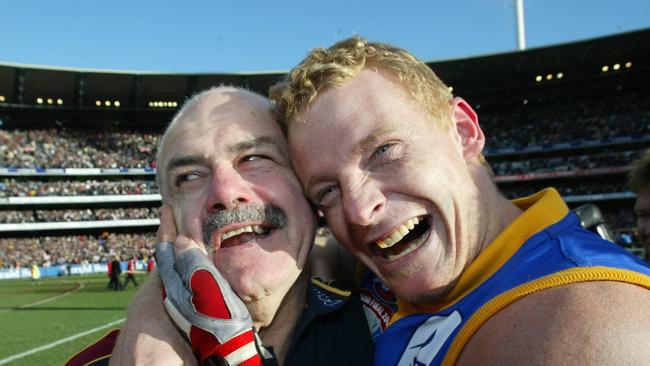 Leigh Matthews and Michael Voss celebrate after the 2003 Grand Final. Picture: David Kapernick