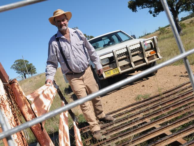 FOR NEWS.COM.AU STORY ONLY - DO NOT USE - Atholwood, NSW couple Robert Crowther and Kathryn Crowther - couple that are living on the land who have got the law and their neighbours offside because of various "incidents" but feel they have been hard done by. Pictured: Graham with gate that was bumpedPicture: David Doyle for news.com.au