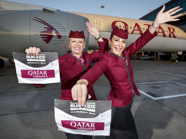 17/03/2021 Qatar ground staff Alida DiGiantomasso and Ruby El Haji with their Run for the kids bibs at Melbourne airport with a Qatar airways plane. Qatar is to announce support of the Good Friday Appeal and provision of the major prize for Virtual R4K.Picture David Geraghty