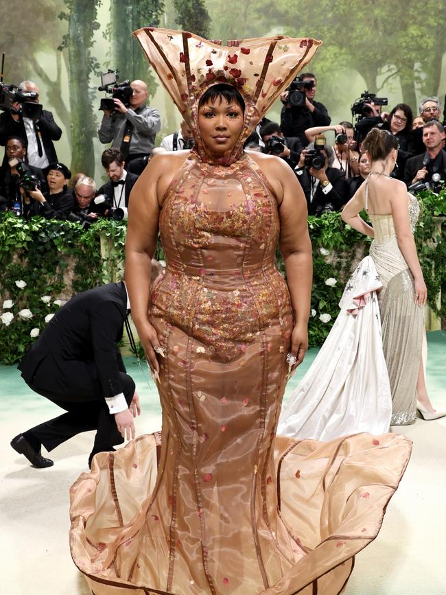 While her face was glowing, Lizzo’s difficult to manoeuvre in outfit sadly left her posing for pictures like a child arriving at their parent’s bedroom door at 2am to say they’ve thrown up: Getty.