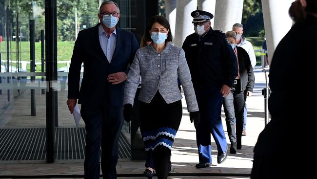 NSW Health Minister Brad Hazzard (left) and NSW Premier Gladys Berejiklian (centre) arrive for a COVID-19 press conference in Sydney. Picture: NCA NewsWire/Bianca De Marchi