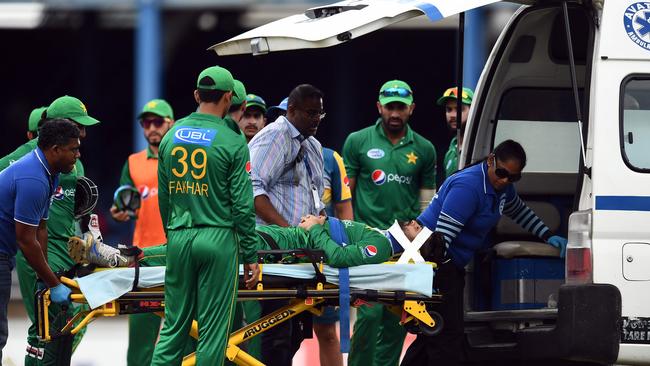 Pakistan's Ahmed Shehzad is taken off the field in an ambulance.