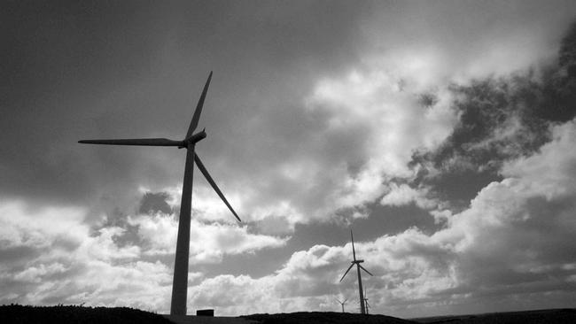 A row of wind turbine's against a stormy sky at Codrington. Windmills, Wind turbines, Farms