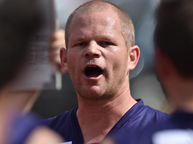 Diggers Rest coach Jamie Lobb addresses his players during the RDFL footy match at the Diggers Rest Recreation Reserve, Saturday, April 6, 2019. RDFL footy: Diggers Rest v Rupertswood. (AAP Image/James Ross) NO ARCHIVING