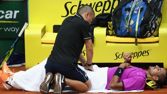 MADRID, SPAIN — MAY 08: Nick Kyrgios of Australia receives treatment in his match against Marcos Baghdatis of Cyprus during day three of the Mutua Madrid Open tennis at La Caja Magica on May 8, 2017 in Madrid, Spain. (Photo by Julian Finney/Getty Images)