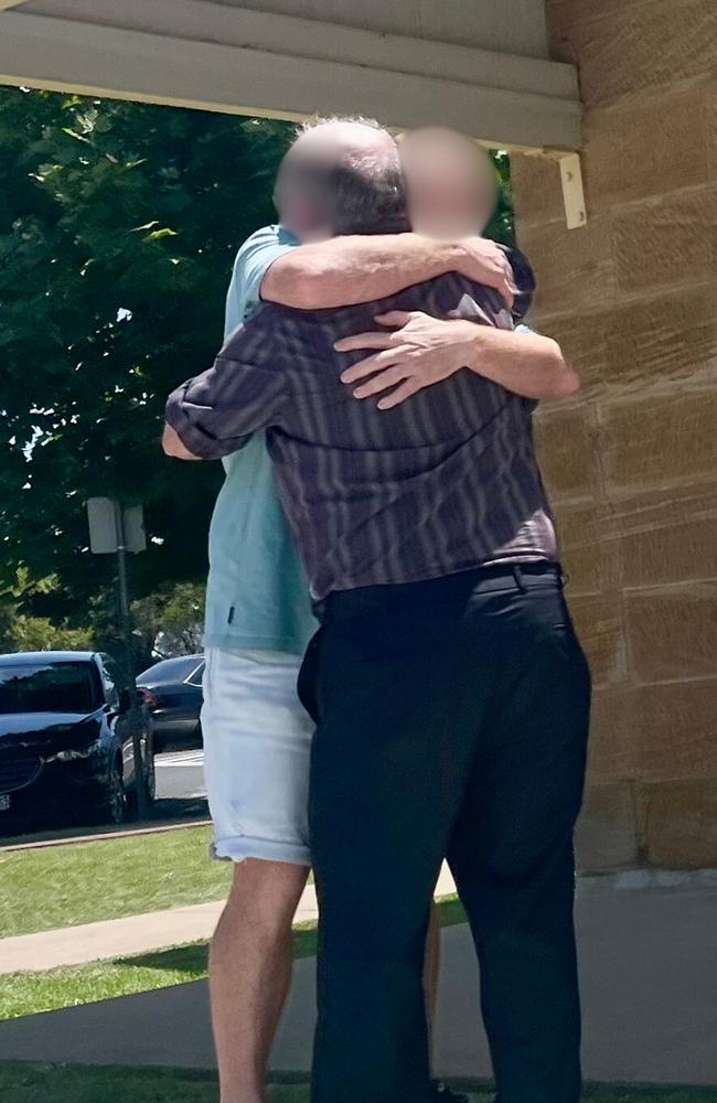 The man hugging a supporter before being found guilty and jailed for seven years on November 7, 2024.