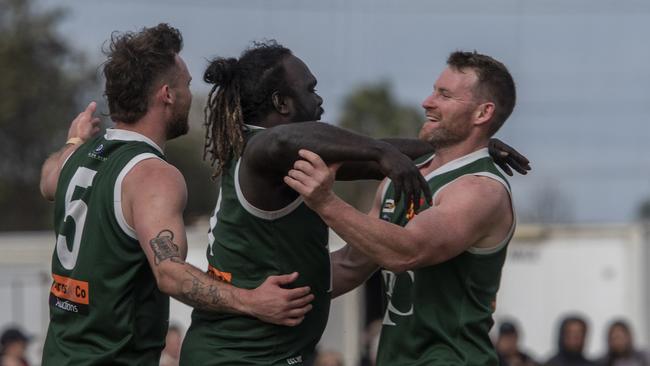 Anthony McDonald-Tipungwuti and his teammates celebrate Imperial’s win in the Sunraysia league. Photographer: Noel Fisher