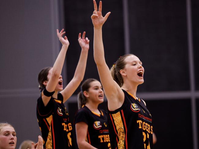 Melbourne Tigers players celebrate on the sidelines during the Under-18 Club Championships. Picture: Michael Farnell