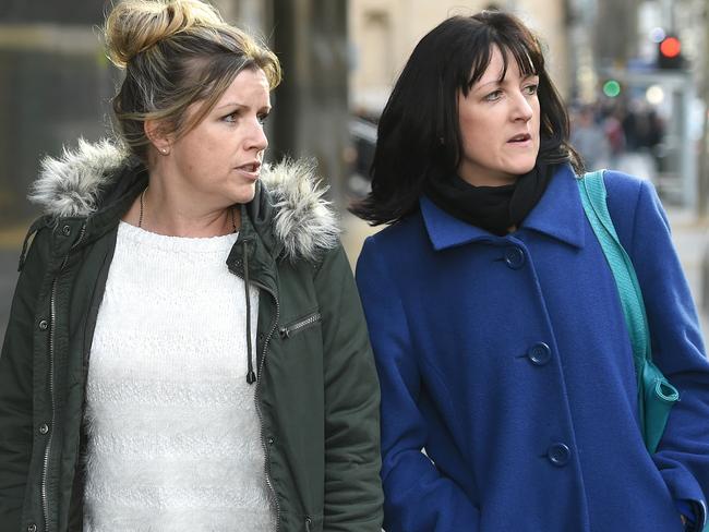 Nicola Komiazyk (right) and her sister Mandy Hodson at the coroners court after attending former detective Paul Dale's hearing to be excused from giving evidence at an inquest into their parent’s murders. Picture: Jake Nowakowski