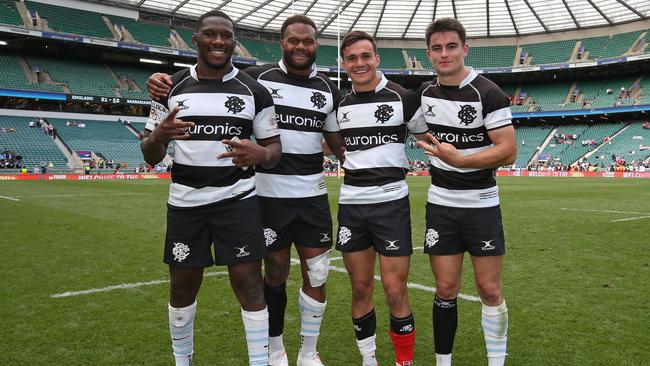 Yoan Tanga, Virimi Vakatawa, Max Spring and Nolann Le Garrec of the Barbarians celebrate after the win.