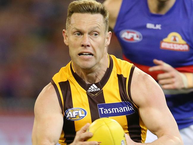 AFL. 2nd Semi Final. Hawthorn v Western Bulldogs at the MCG. Sam Mitchell gives Marcus Bontempelli the slip . Pic: Michael Klein.