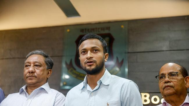 Shakib al Hasan (C) speaks with media after learning of his ban. Picture: STR/AFP