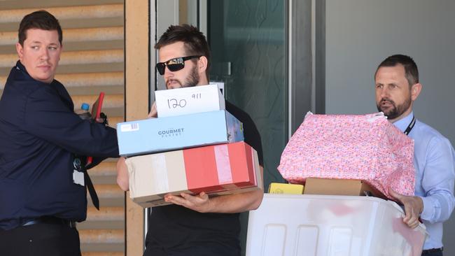 Jake Giddon and a Detective carry out gifts for Cleo. Picture: The West Australian