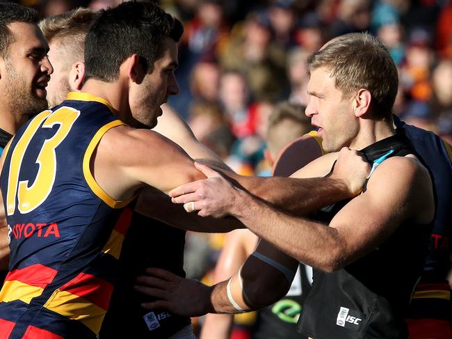 30/6/14 - AFL Round 15 - Showdown XXXVII (37) - Adelaide v Port Adelaide at Adelaide Oval - Taylor Walker and Kane CornesPicture Simon Cross