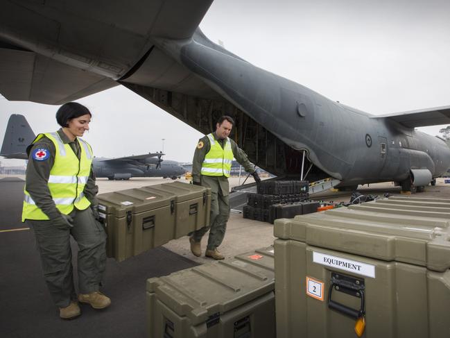 Flight Lieutenant Danielle Polgar (left) and Squadron Leader Shamus Shepherd prepare medical equipment. Picture: ADF