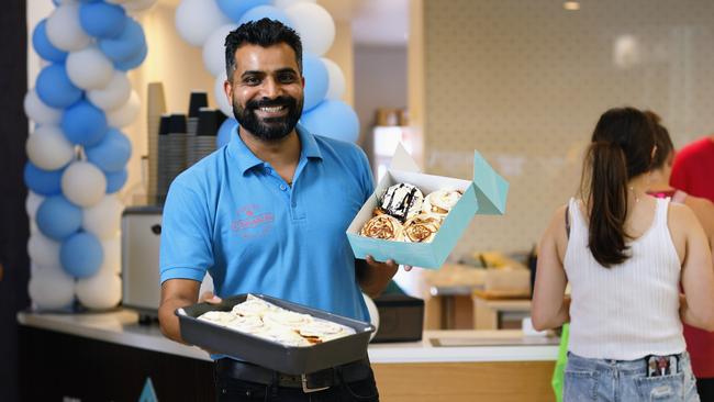 Cinnabon opened its first Far North Queensland store at Cairns Central on Wednesday, with the takeaway outlet selling a variety of cinnamon rolls, coffee and cold drinks. Cinnabon Cairns Central manager Suri Singh has been overwhelmed by the popularity of the company's sweet snacks in the first 4 days of the new store opening. Picture: Brendan Radke