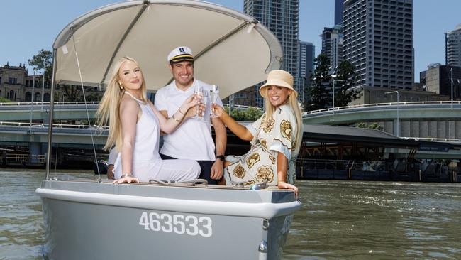 Jada Cerneka, Alberto Ruiz Lopez and Jacara Desland enjoying a cruise on a GoBoat on the Brisbane River. Picture: Lachie Millard