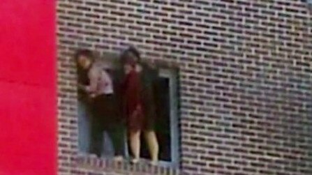 Pingkang Zhang and Yinuo Jiang climbed out the window of their flat before jumping to escape the fire. Picture: ABC News