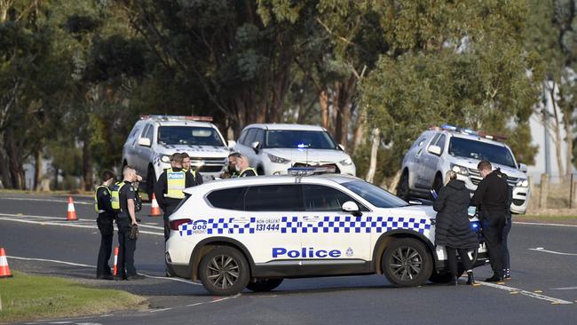 Police block a road at the scene of an alleged shooting at a roadside florist on Gisborne-Melton Road in Melton. Picture: NCA NewsWire / Andrew Henshaw