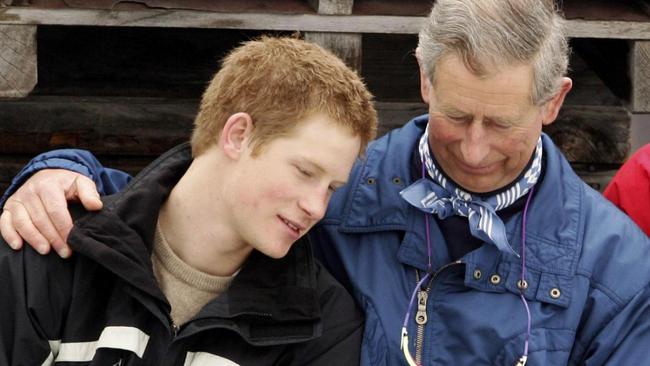 Harry and Charles share a tender moment at a Swiss ski resort in 2005. Picture: Pascal le Segretain/Getty Images/The Times