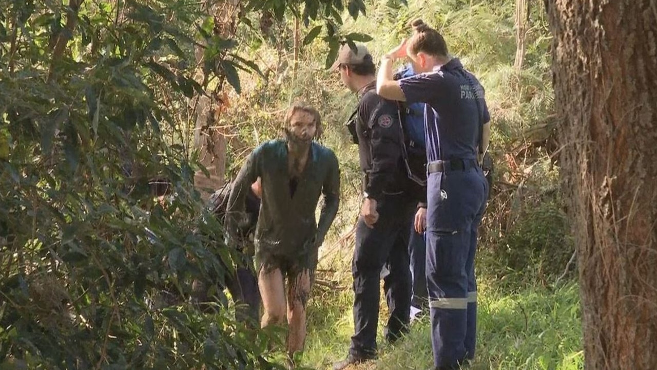 Elle Booth ran into Georges River to try and escape the two dogs. Picture: 9 News