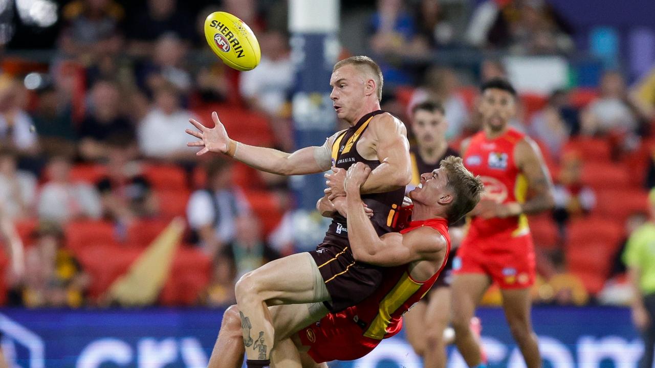 Will Graham takes Hawks midfielder James Worpel down. Picture: Getty Images