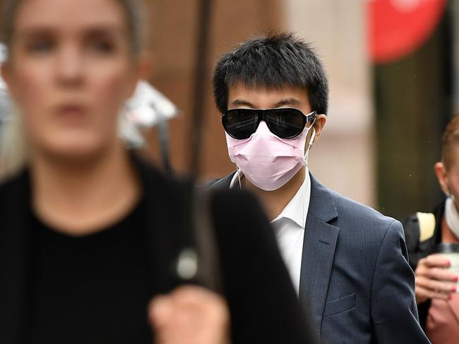 A man wearing a face mask as a preventative measure against coronavirus COVID-19 in Sydney, Monday, March 16, 2020. (AAP Image/Joel Carrett) NO ARCHIVING